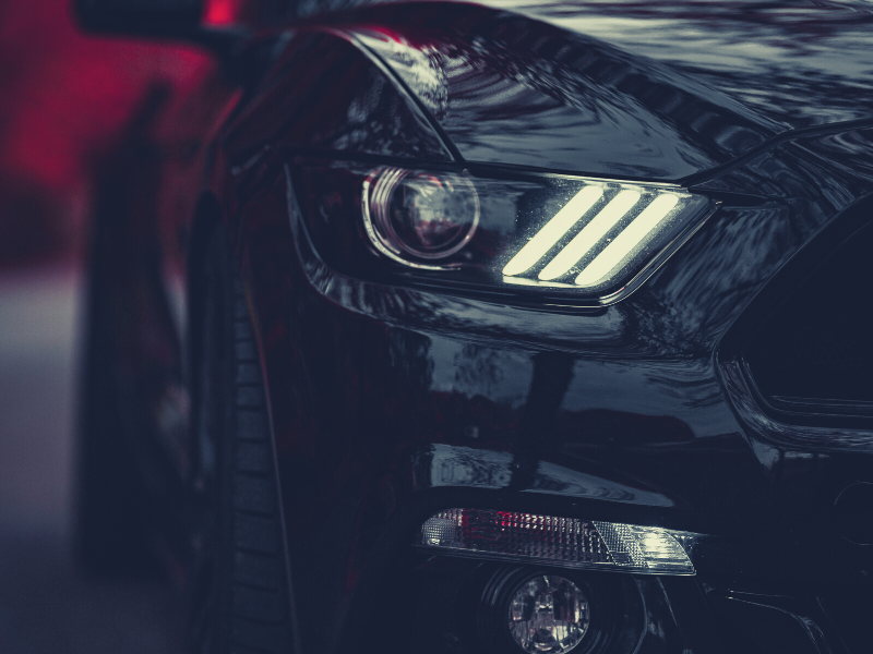 an up close shot of a black 2020 ford mustang